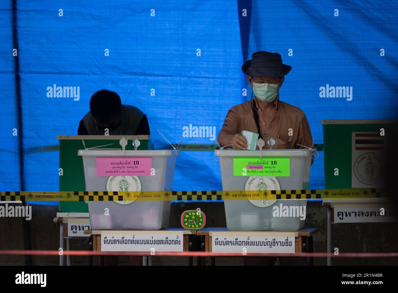 Bangkok, Thailand. 14th May, 2023. A man casts his ballot during voting for general election at polling station in Bangkok on May 14, 2023. (Photo by Teera Noisakran/Pacific Press) Credit: Pacific Press Media Production Corp./Alamy Live News Stock Photo