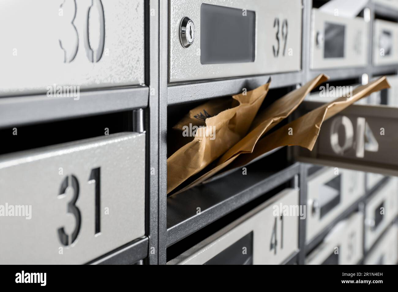 Open mailbox with keyhole, number and envelopes, closeup Stock Photo