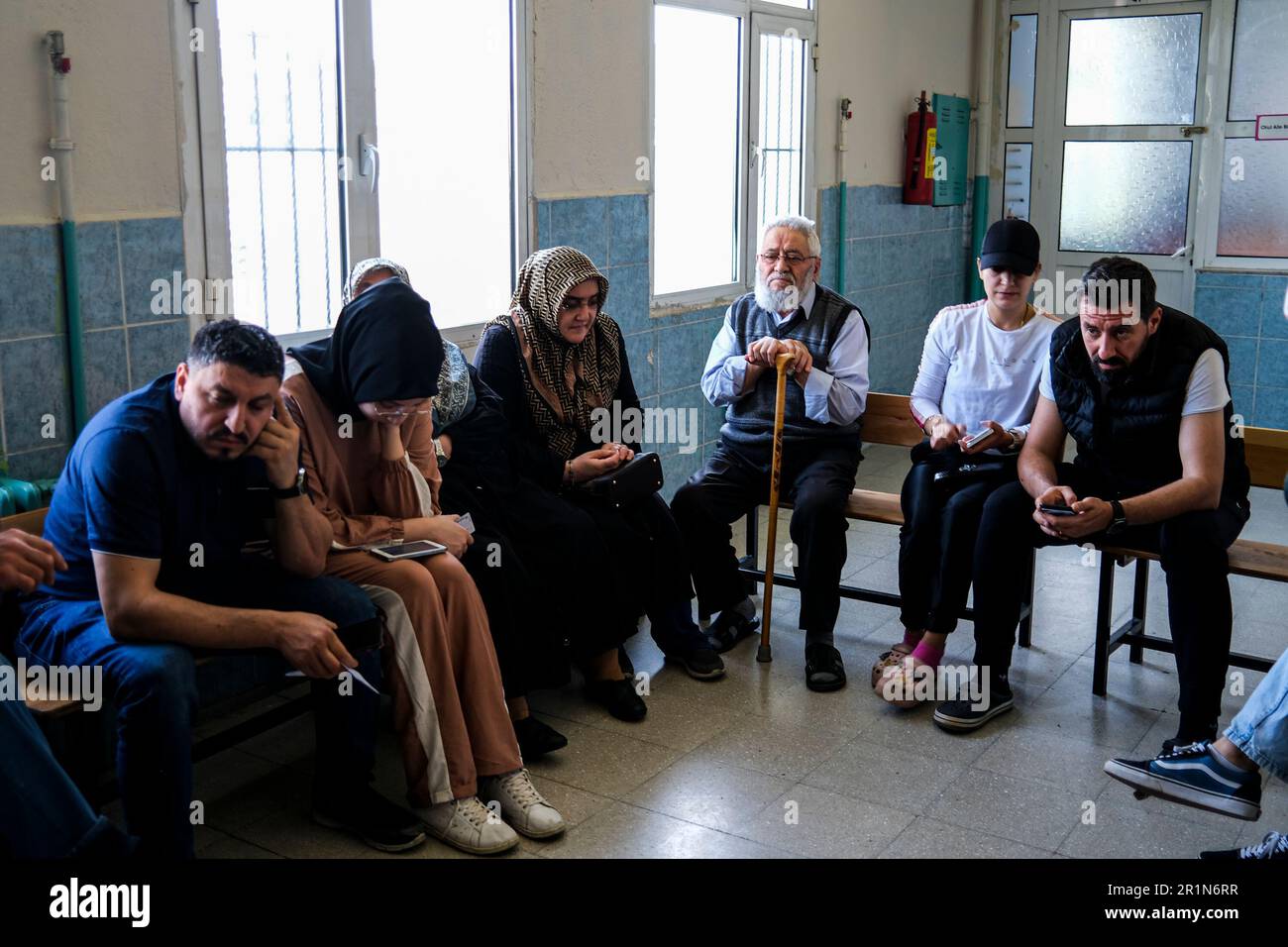 Izmir, Turkey. 14th May, 2023. People wait in line to vote. Turkish voters proceed to their respective precincts to vote for their favored candidates in the 2023 presidential and parliamentary elections in Turkey. It is said that this is the biggest elections in Turkey history. (Photo by Murat Kocabas/SOPA Images/Sipa USA) Credit: Sipa USA/Alamy Live News Stock Photo