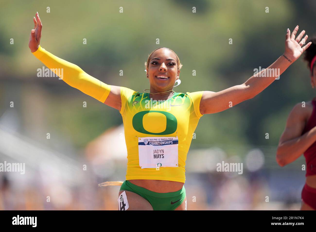 Jadyn Mays of Oregon celebrates after winning the women's 100m during