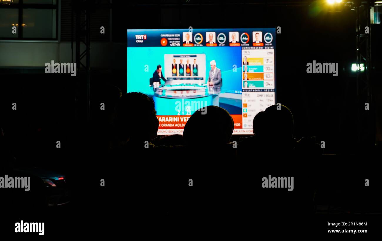 Izmir, Turkey. 15th May, 2023. AK Party supporters are watching live updates of the Turkish 2023 General Elections at midnight in front of the AK Party Izmir Provincial Presidency. Erdogan leads with 49.49% of the vote, Kilicdaroglu takes 44.79% of the vote after 91.93% of ballots were counted, the head of Turkey's Supreme Election Council said in early Monday. (Photo by Idil Toffolo/Pacific Press) Credit: Pacific Press Media Production Corp./Alamy Live News Stock Photo