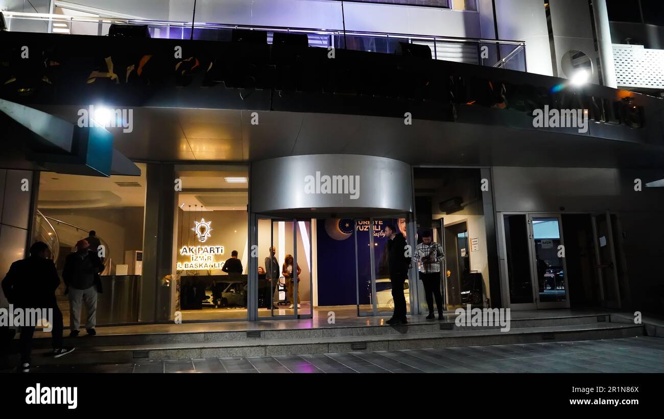 Izmir, Turkey. 15th May, 2023. AK Party supporters are watching live updates of the Turkish 2023 General Elections at midnight in front of the AK Party Izmir Provincial Presidency. Erdogan leads with 49.49% of the vote, Kilicdaroglu takes 44.79% of the vote after 91.93% of ballots were counted, the head of Turkey's Supreme Election Council said in early Monday. (Photo by Idil Toffolo/Pacific Press) Credit: Pacific Press Media Production Corp./Alamy Live News Stock Photo