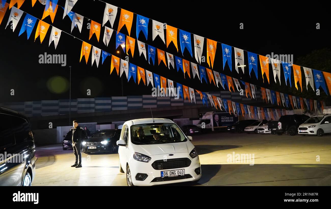 Izmir, Turkey. 15th May, 2023. AK Party supporters are watching live updates of the Turkish 2023 General Elections at midnight in front of the AK Party Izmir Provincial Presidency. Erdogan leads with 49.49% of the vote, Kilicdaroglu takes 44.79% of the vote after 91.93% of ballots were counted, the head of Turkey's Supreme Election Council said in early Monday. (Photo by Idil Toffolo/Pacific Press) Credit: Pacific Press Media Production Corp./Alamy Live News Stock Photo