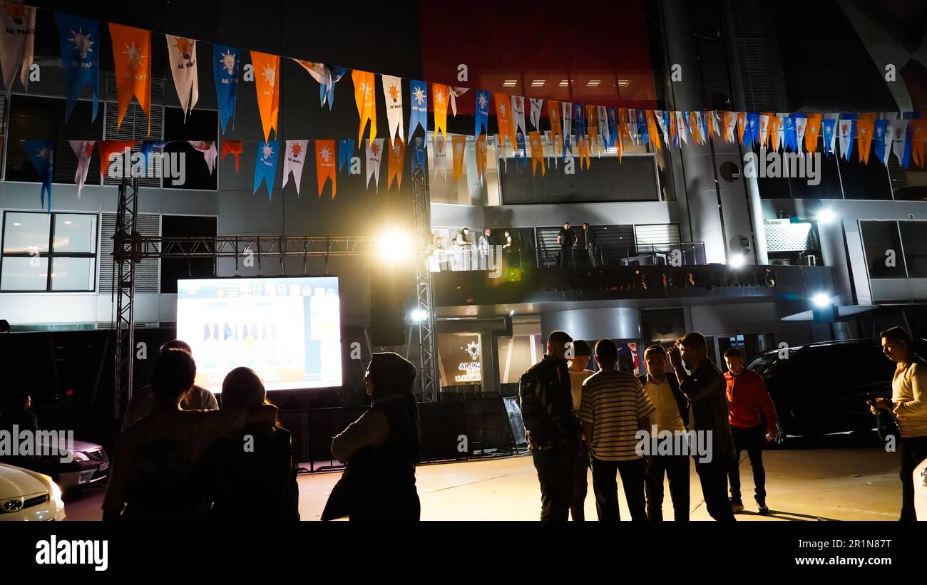 Izmir, Turkey. 15th May, 2023. AK Party supporters are watching live updates of the Turkish 2023 General Elections at midnight in front of the AK Party Izmir Provincial Presidency. Erdogan leads with 49.49% of the vote, Kilicdaroglu takes 44.79% of the vote after 91.93% of ballots were counted, the head of Turkey's Supreme Election Council said in early Monday. (Photo by Idil Toffolo/Pacific Press) Credit: Pacific Press Media Production Corp./Alamy Live News Stock Photo