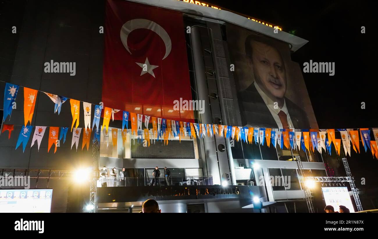 Izmir, Turkey. 15th May, 2023. AK Party supporters are watching live updates of the Turkish 2023 General Elections at midnight in front of the AK Party Izmir Provincial Presidency. Erdogan leads with 49.49% of the vote, Kilicdaroglu takes 44.79% of the vote after 91.93% of ballots were counted, the head of Turkey's Supreme Election Council said in early Monday. (Photo by Idil Toffolo/Pacific Press) Credit: Pacific Press Media Production Corp./Alamy Live News Stock Photo