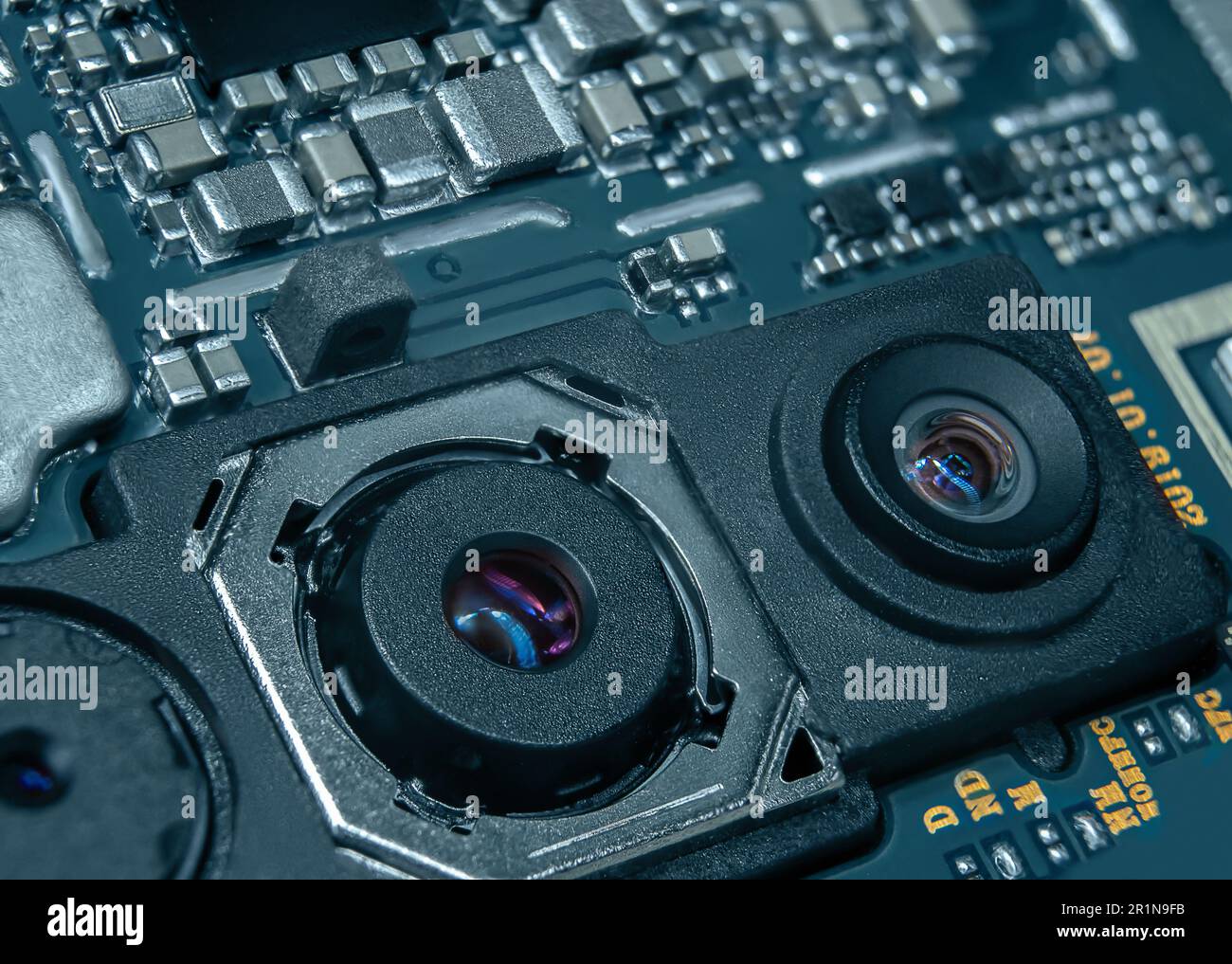 Macro shot of the smartphone's main board with the camera unit in the foreground Stock Photo