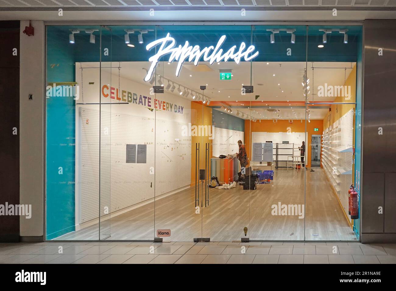 Paperchase store front sign workers clearing shop fittings from Lakeside shopping mall premises after business went into administration England UK Stock Photo