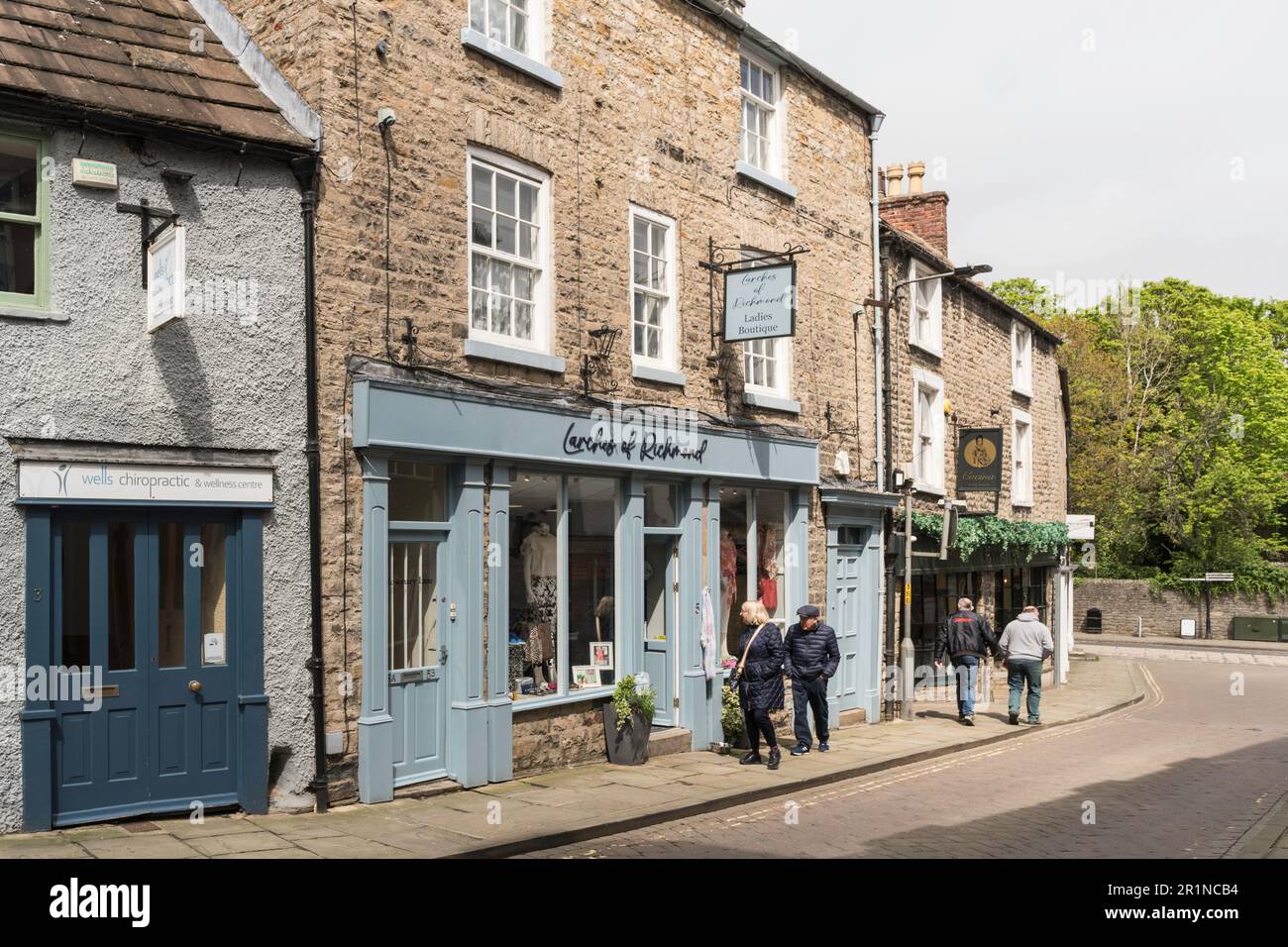 Older couple walking past Larches of Richmond in Rosemary Lane