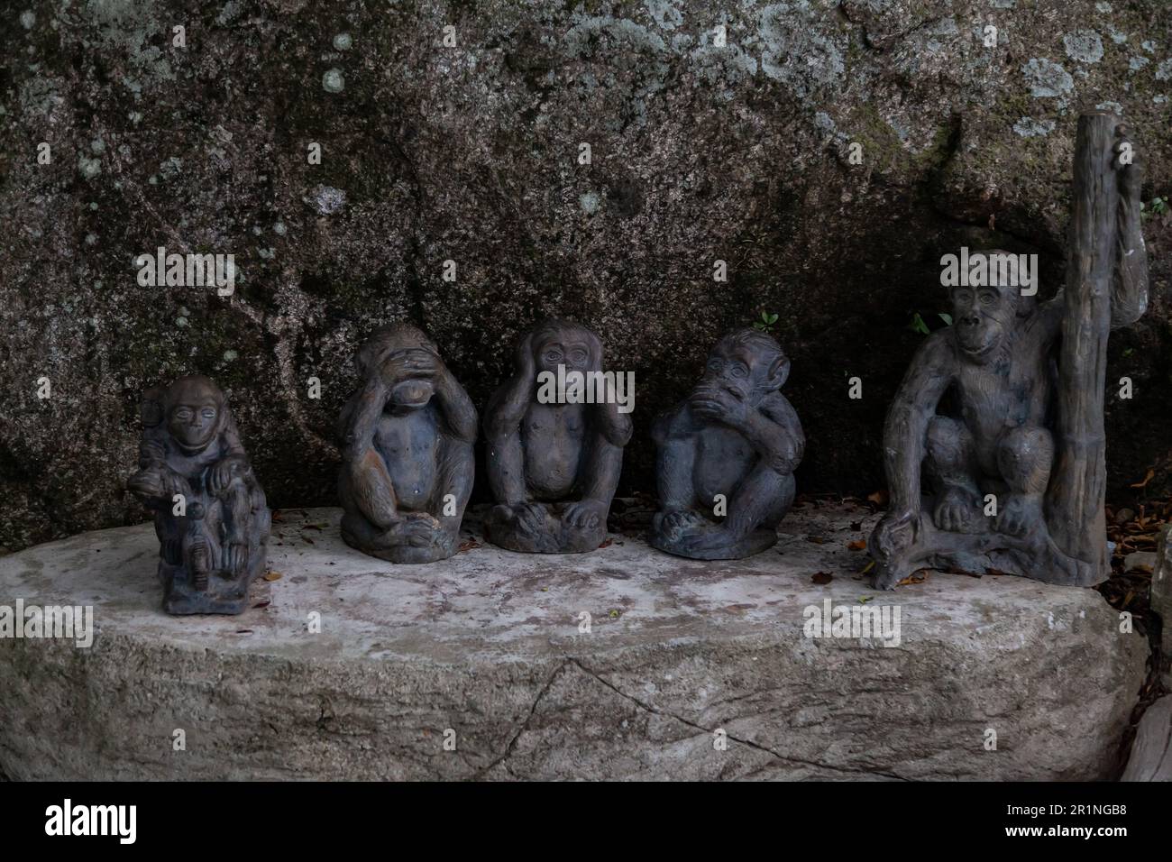 three wise monkeys sculpture depicting the concept of Buddhism Stock Photo