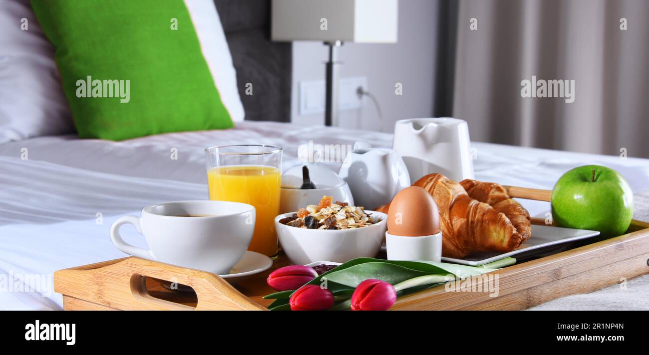 Breakfast on tray in bed in hotel room Stock Photo - Alamy
