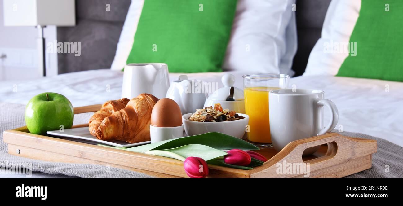 Breakfast on tray in bed in hotel room Stock Photo - Alamy