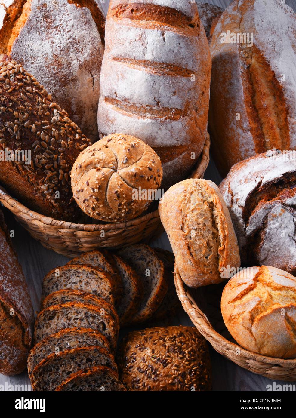 Composition with assorted bakery products in wicker basket Stock Photo