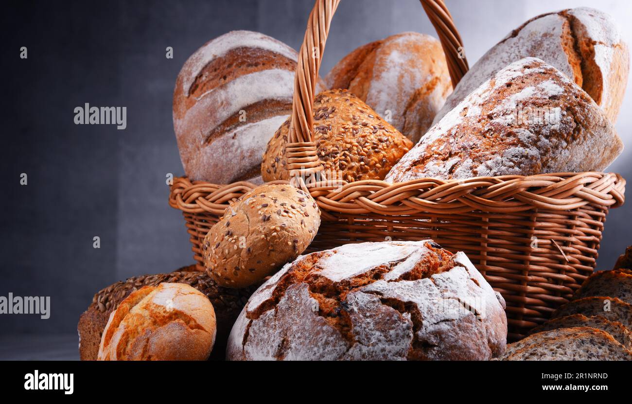 Composition with assorted bakery products in wicker basket Stock Photo