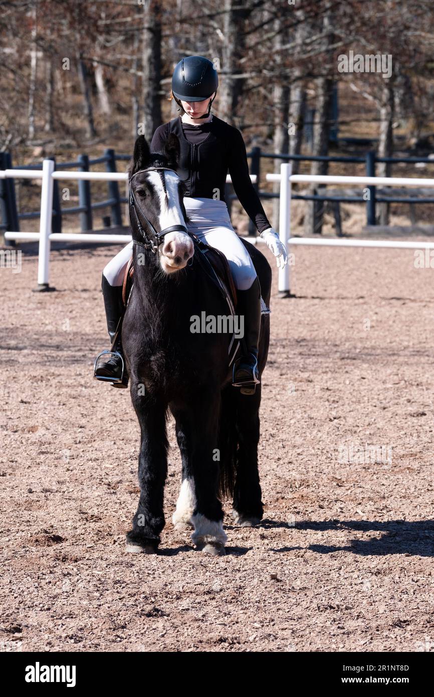 DRESSAGE, YOUTH, PONY: Youth Invitational Dressage Event on a pony in the Åland Islands, Finland. April 2023. Stock Photo