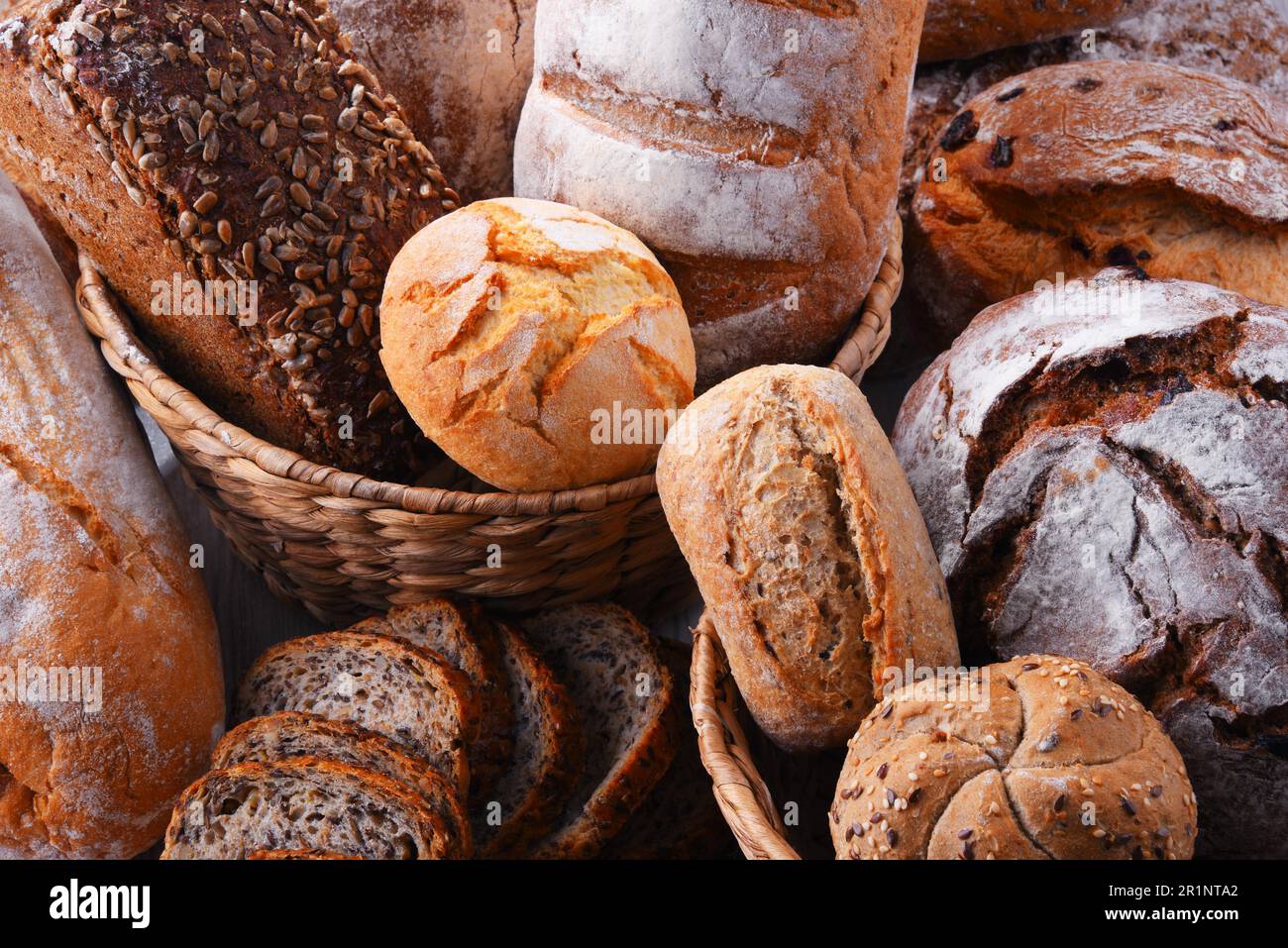 Composition with assorted bakery products in wicker basket Stock Photo