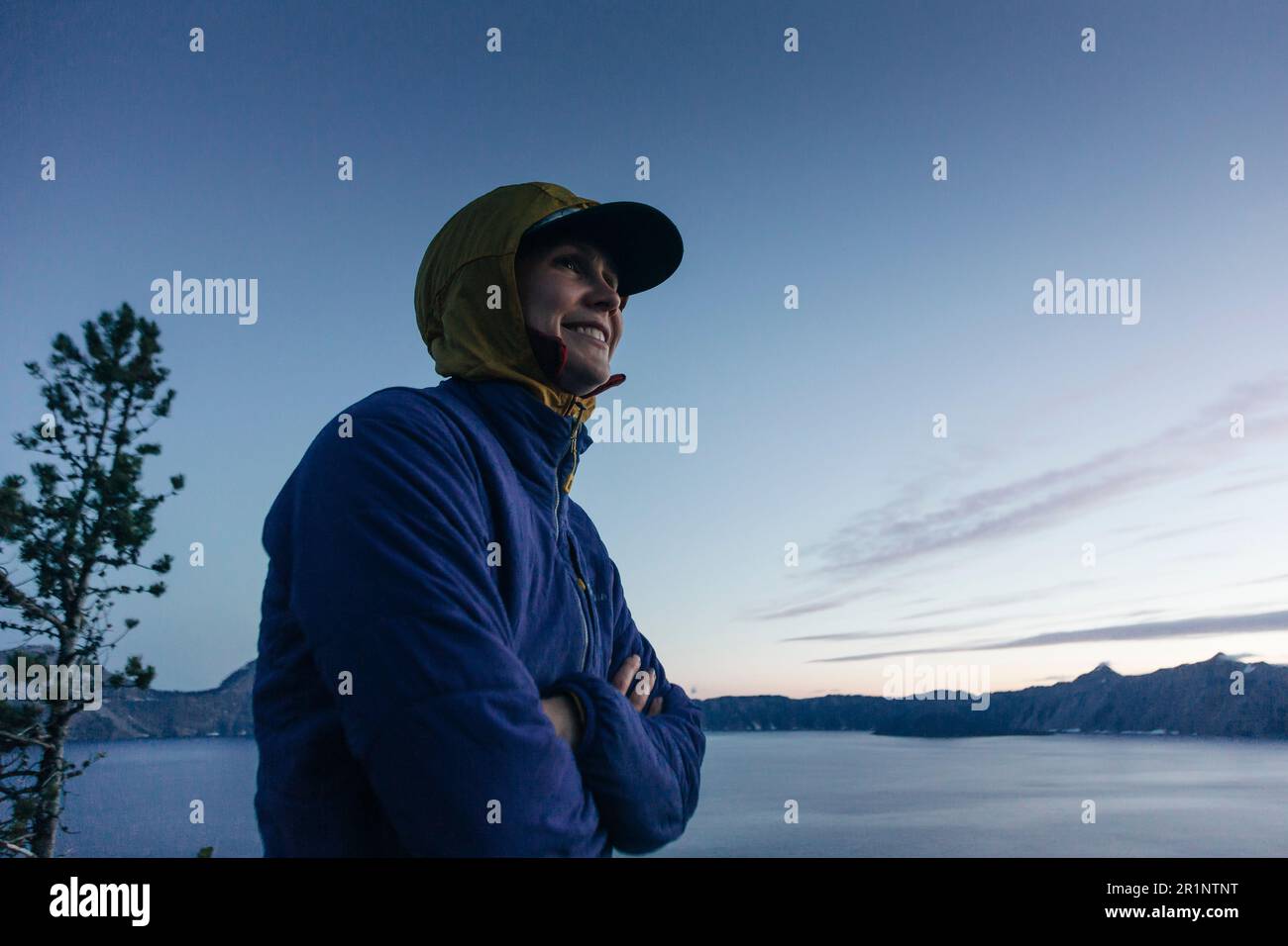 A woman smiles while enjoying Crater Lake National Park in Oregon. Stock Photo