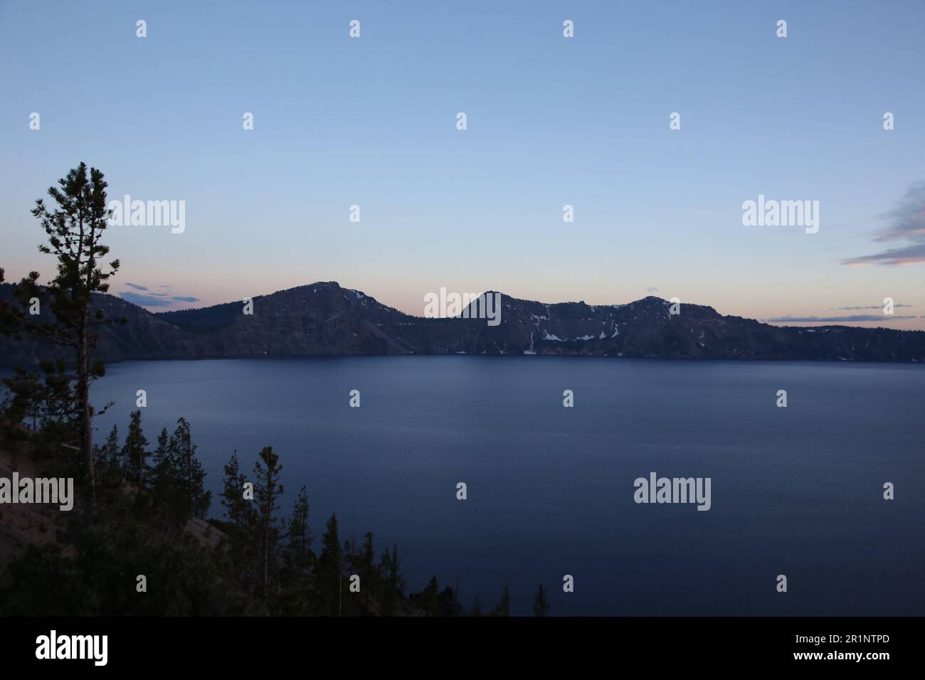 A scenic view of Crater Lake National Park at night. Stock Photo