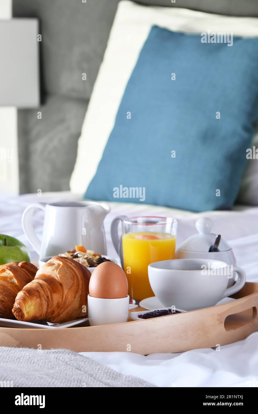 Breakfast on tray in bed in hotel room Stock Photo - Alamy
