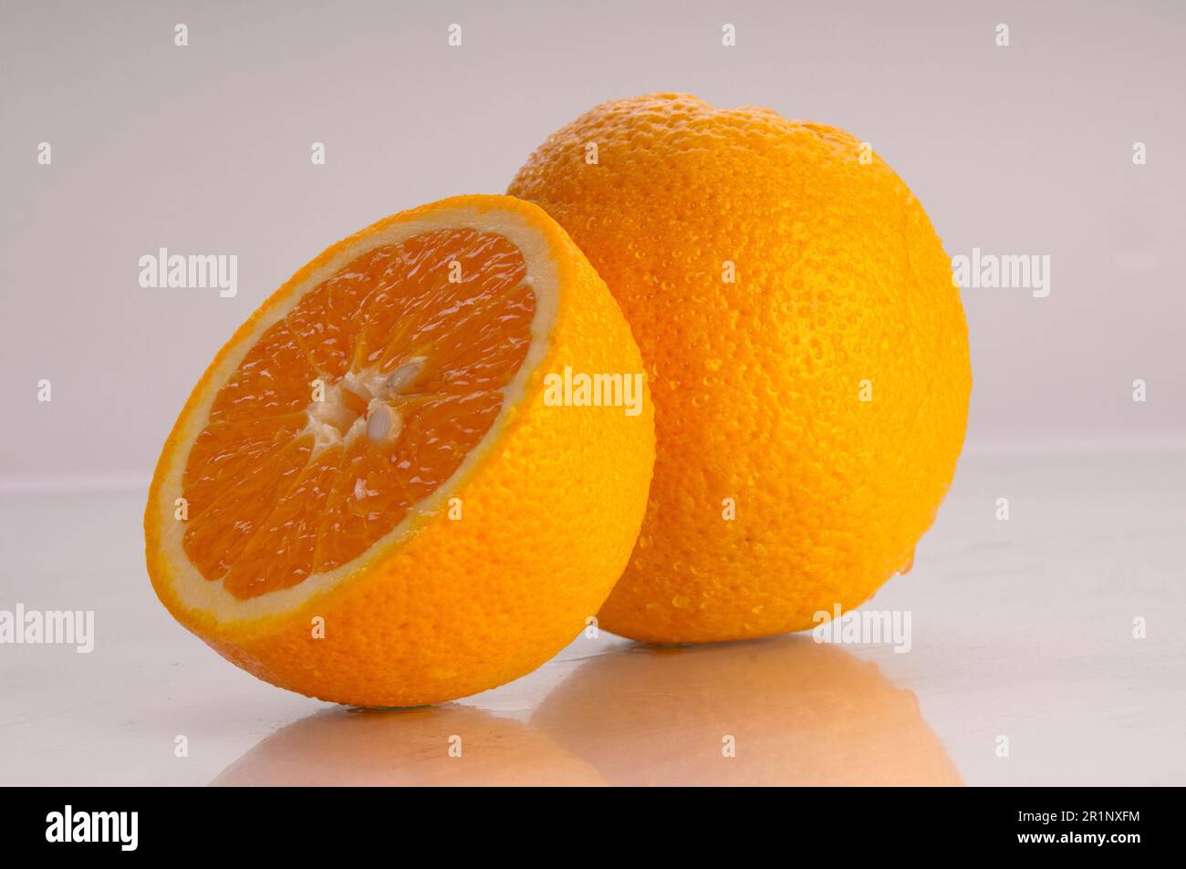 A bright orange citrus fruit against a white background. Stock Photo