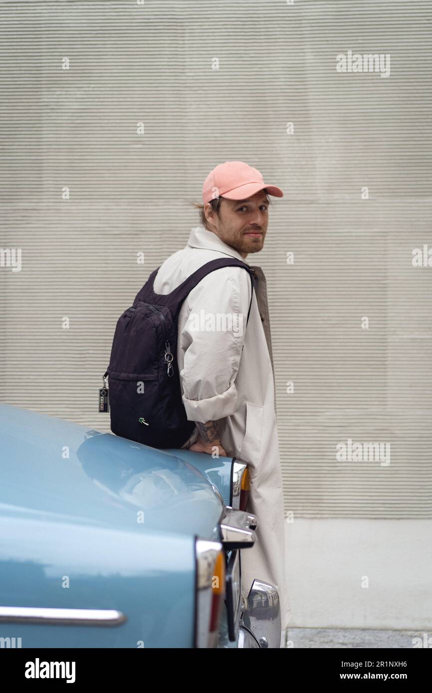 Young man in a retro car. 121 Volvo. Stock Photo