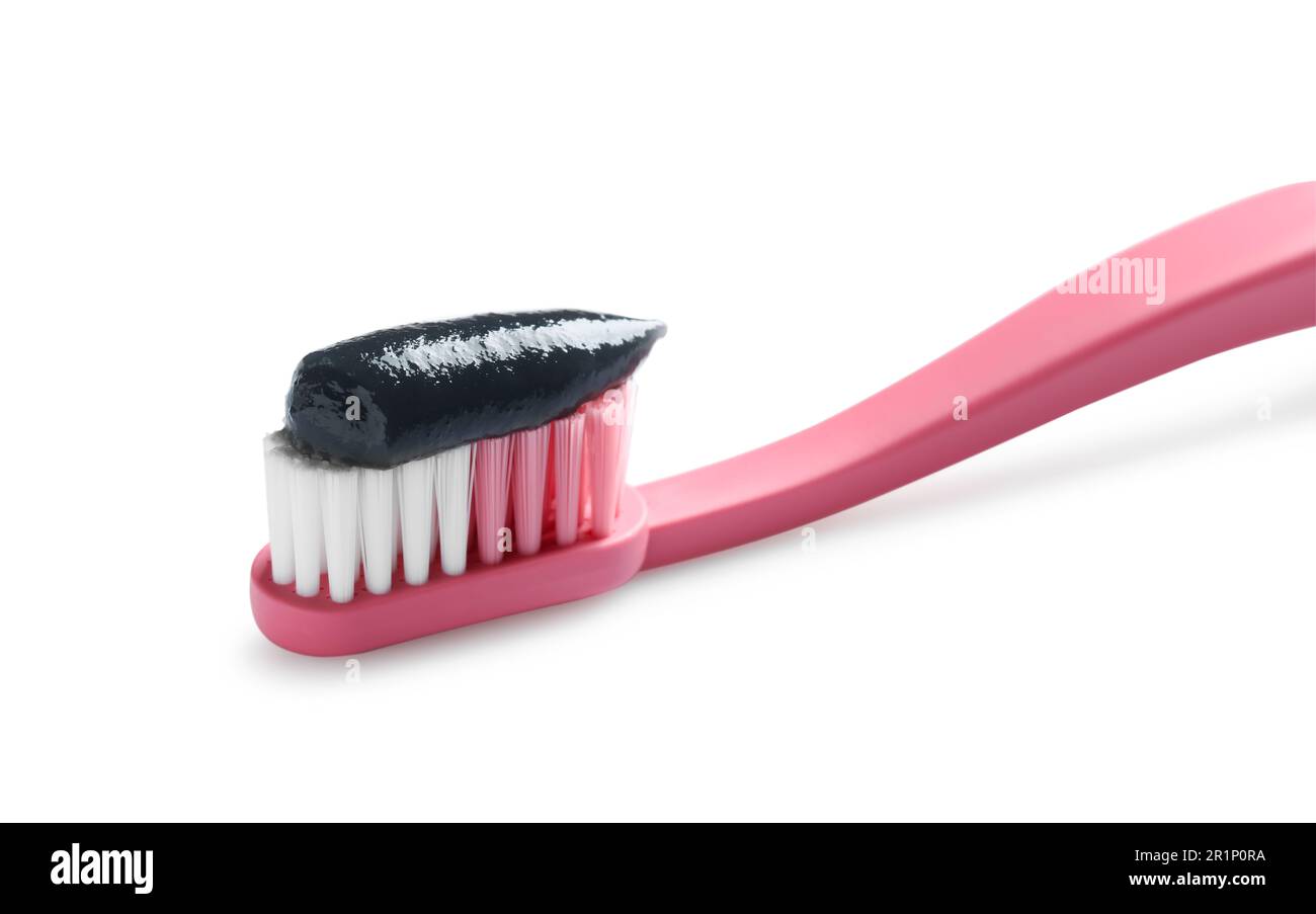Brush with charcoal toothpaste isolated on white Stock Photo - Alamy