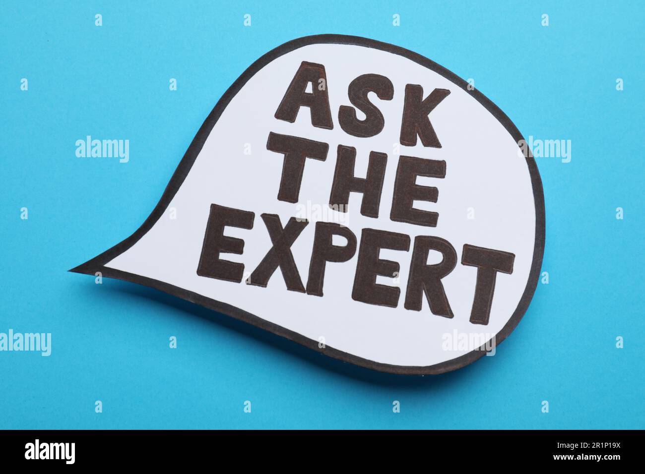 Speech bubble sticker with phrase Ask The Expert on light blue ...