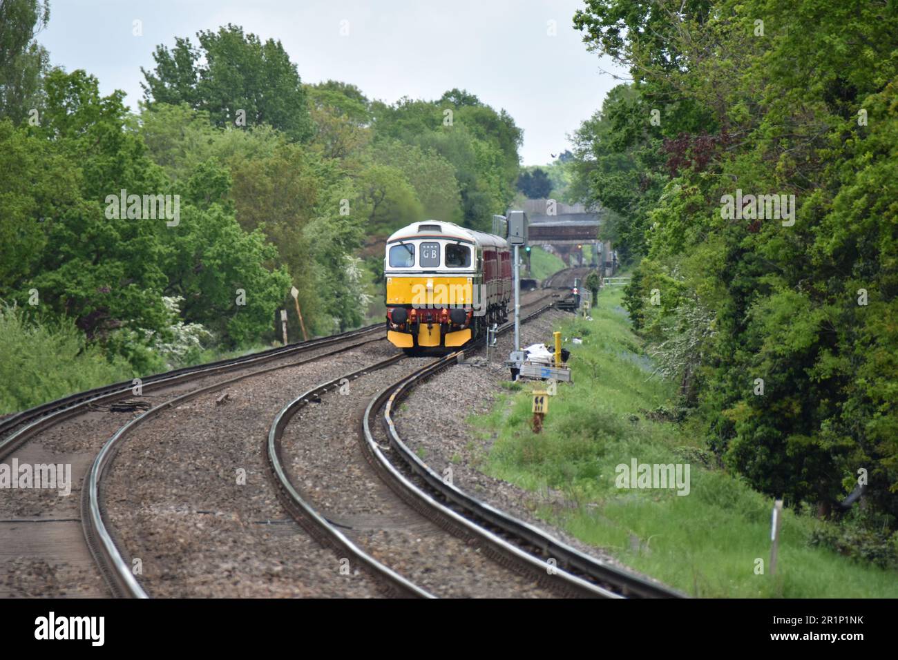 Class 33 33012 (D6515) 'Lt Jenny Lewis RN' Pulling ex-London Transport Rolling Stock Through Winnersh Triangle en-route to Swanage on 11th May 2023 Stock Photo