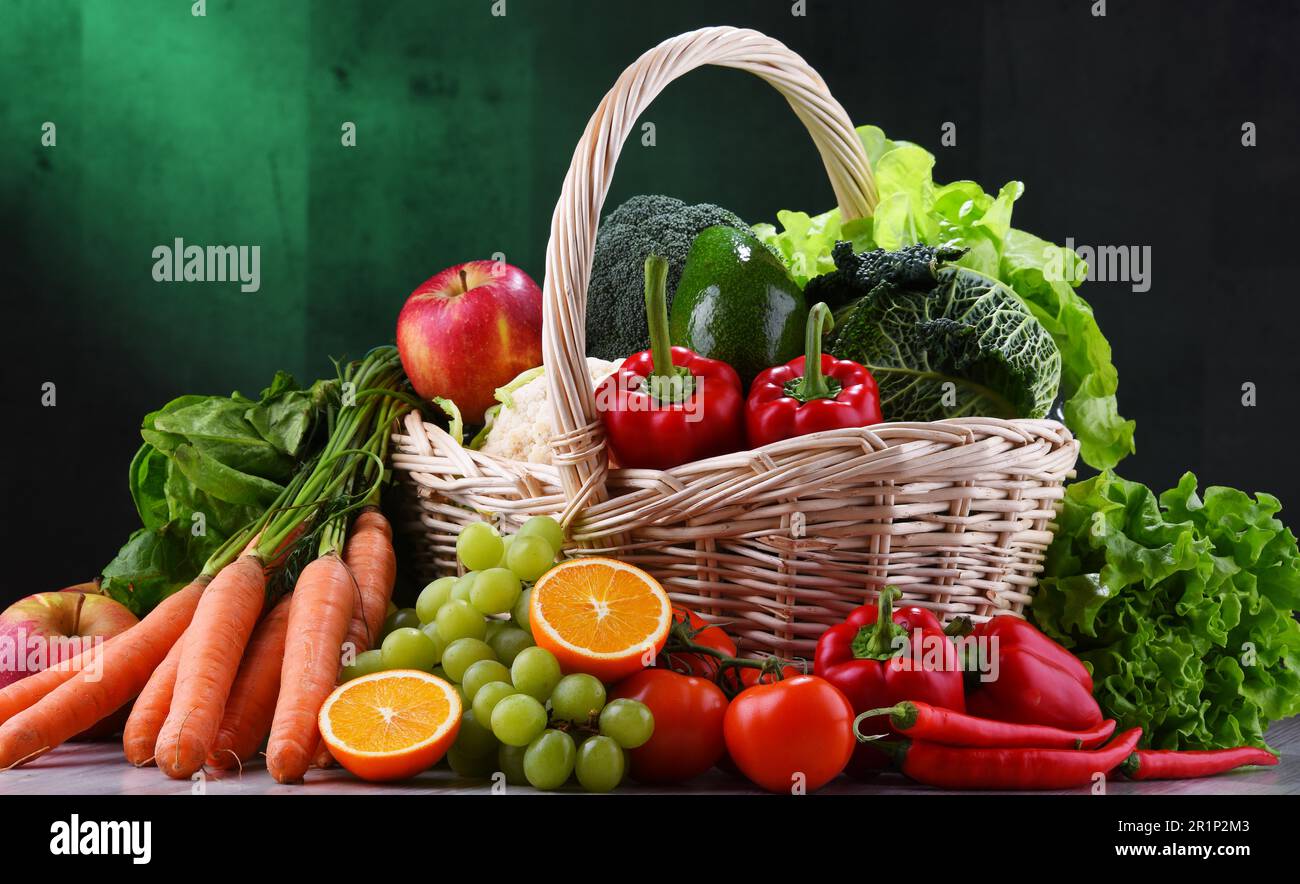 Fresh organic fruits and vegetables in wicker basket Stock Photo - Alamy