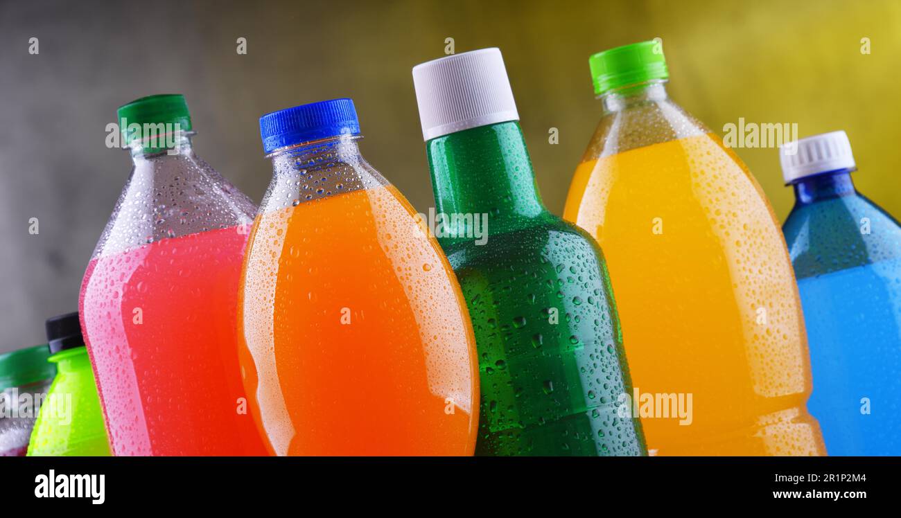 Plastic bottles of assorted carbonated soft drinks in variety of colors