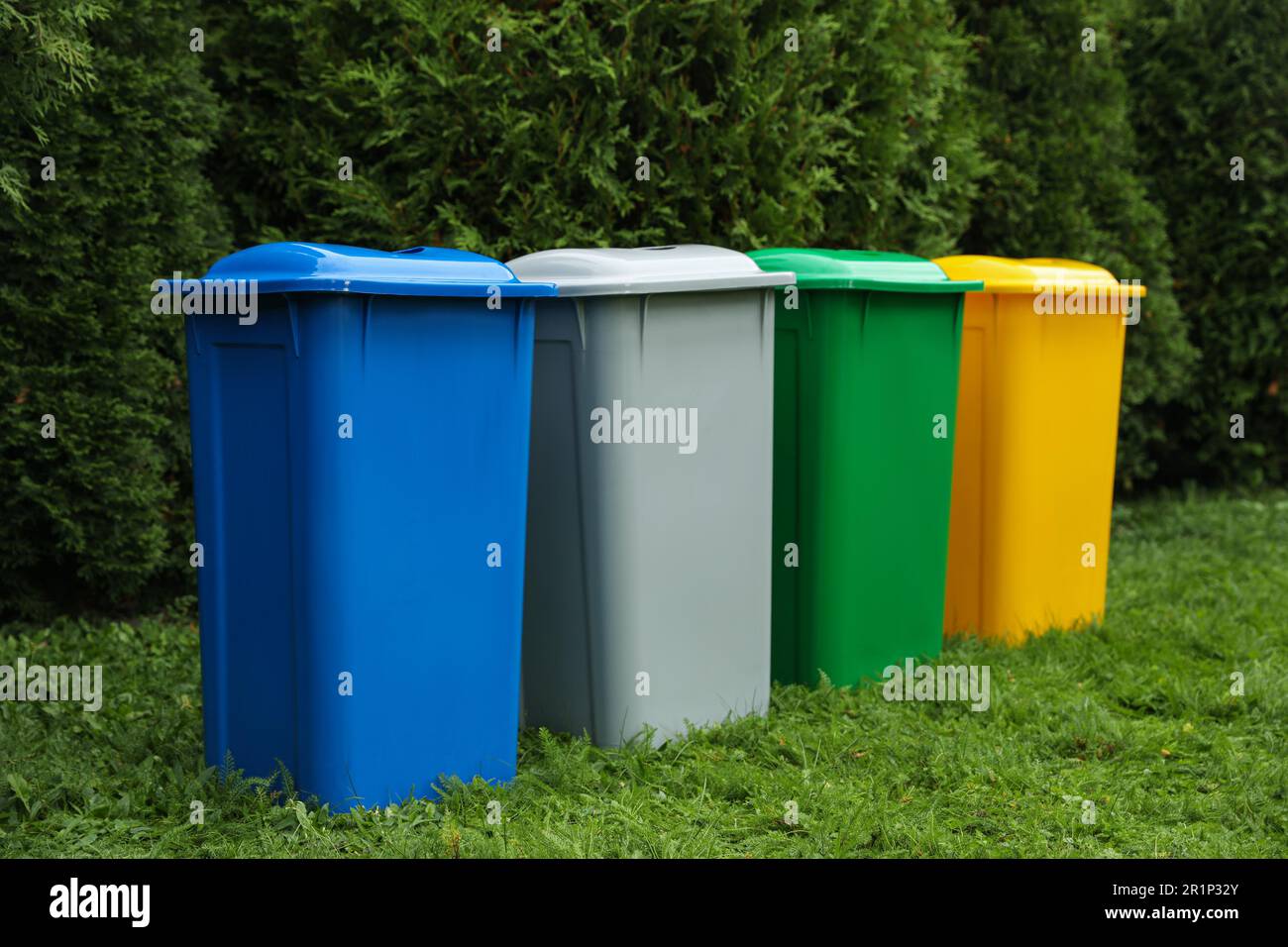 Trash bins on green grass hi-res stock photography and images - Alamy