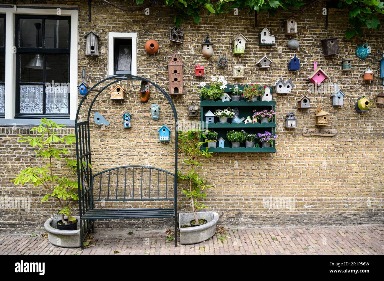 Oosterend, house wall with many birdhouses, Texel Island, North Sea, North Holland, Netherlands Stock Photo