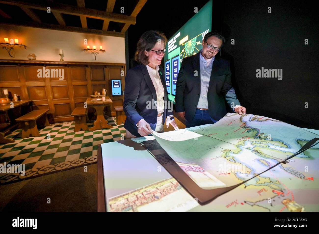 15 May 2023, Schleswig-Holstein, Lübeck: Felicia Sternfeld (l), director of the European Hanse Museum, and Andre Dubisch, project manager, stand in the new 'London' staging during a press tour of the European Hanse Museum. In the new staging, visitors are immersed in a scene of the Stalhof on the banks of the Thames in the period around the year 1478. Photo: Christian Charisius/dpa Stock Photo