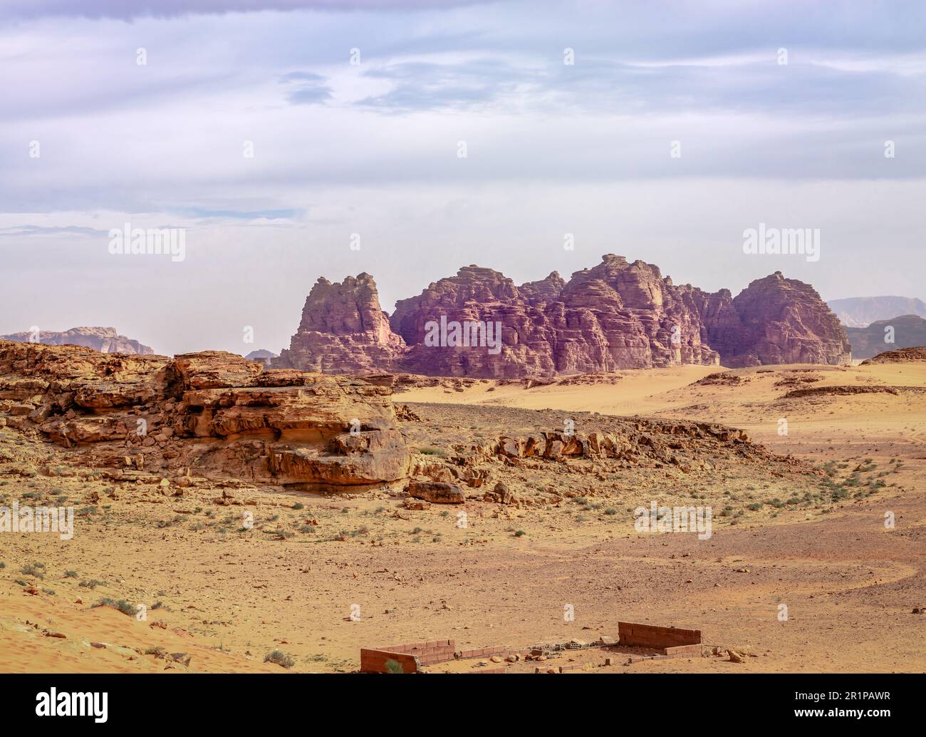 Scenic landscape in Wandi Rum (aka Valley of the Moon), a valley cut into the sandstone and granite rock in southern Jordan. Stock Photo