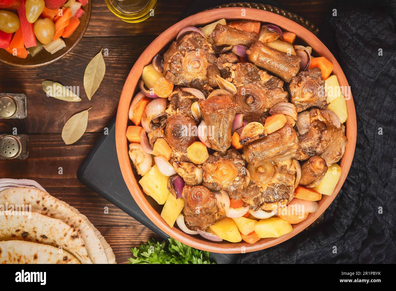 Arabic Cuisine; Egyptian traditional oxtails stew with vegetables. Served with traditional