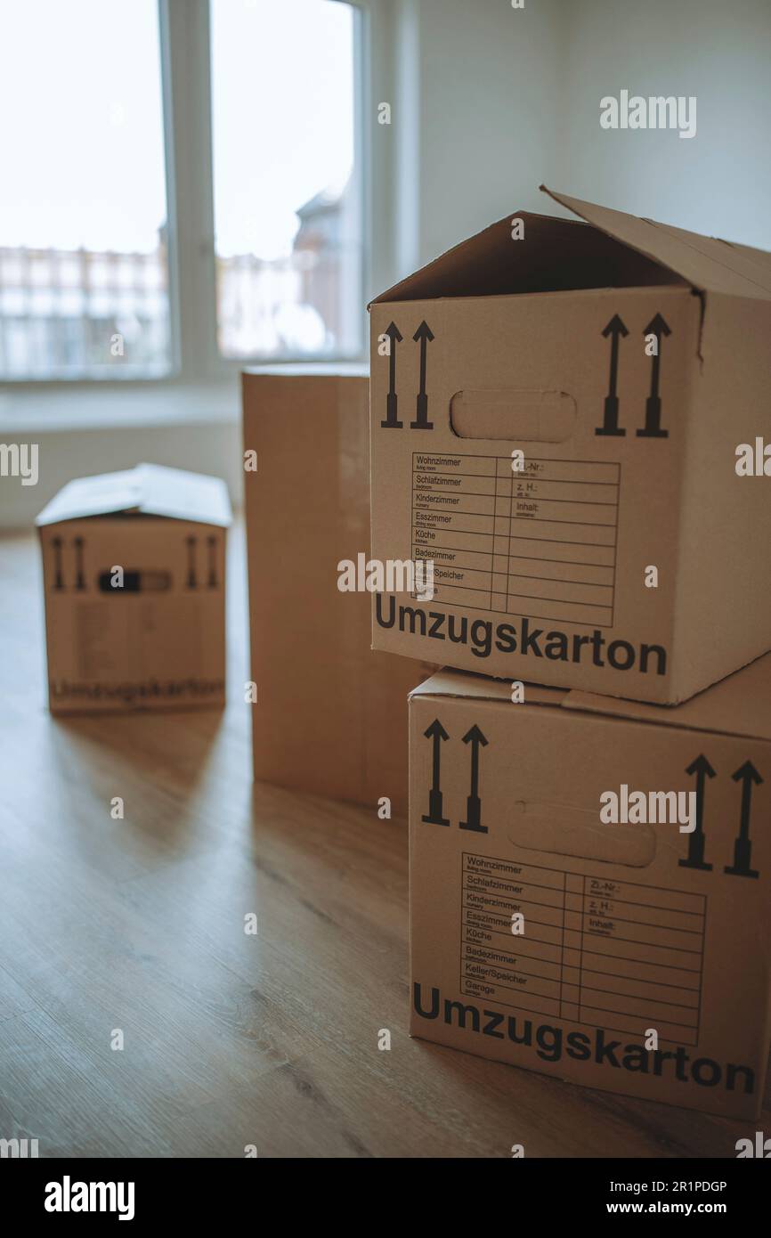Moving boxes in the new apartment Stock Photo - Alamy