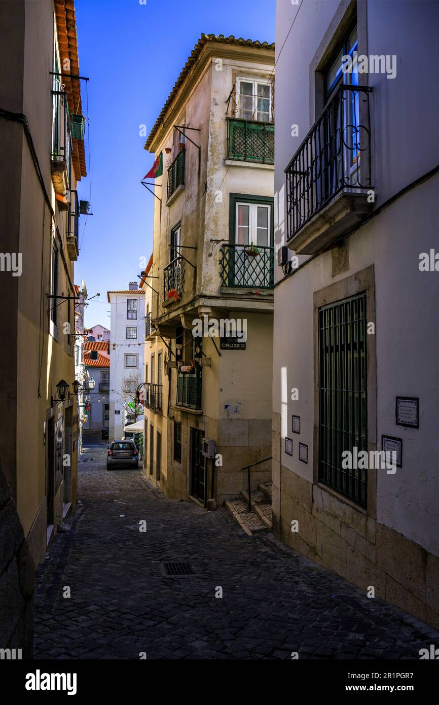 Narrow streets and old houses in the old town of Alfama. Urban living in a city with historic buildings and lots of culture. Lisbon, Portugal Stock Photo