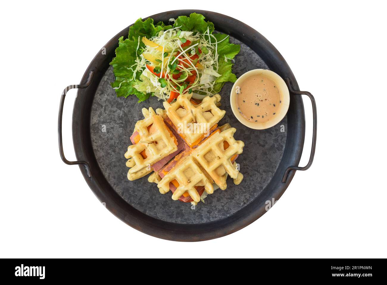 Belgian waffles on white plate with greens closeup Stock Photo