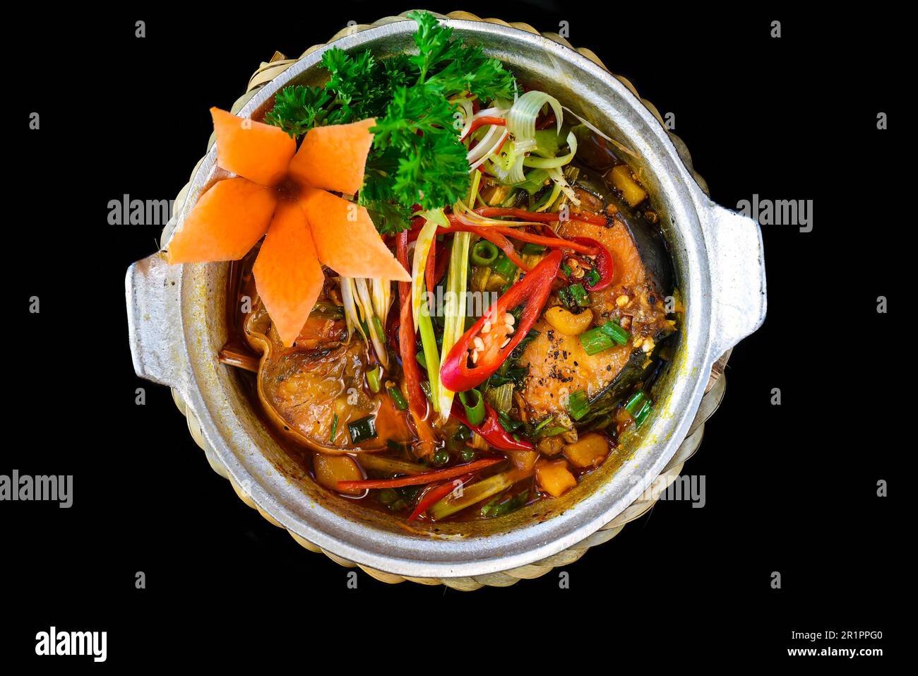 Vietnamese fried Mackerel fish with sauce on black background Stock Photo Alamy