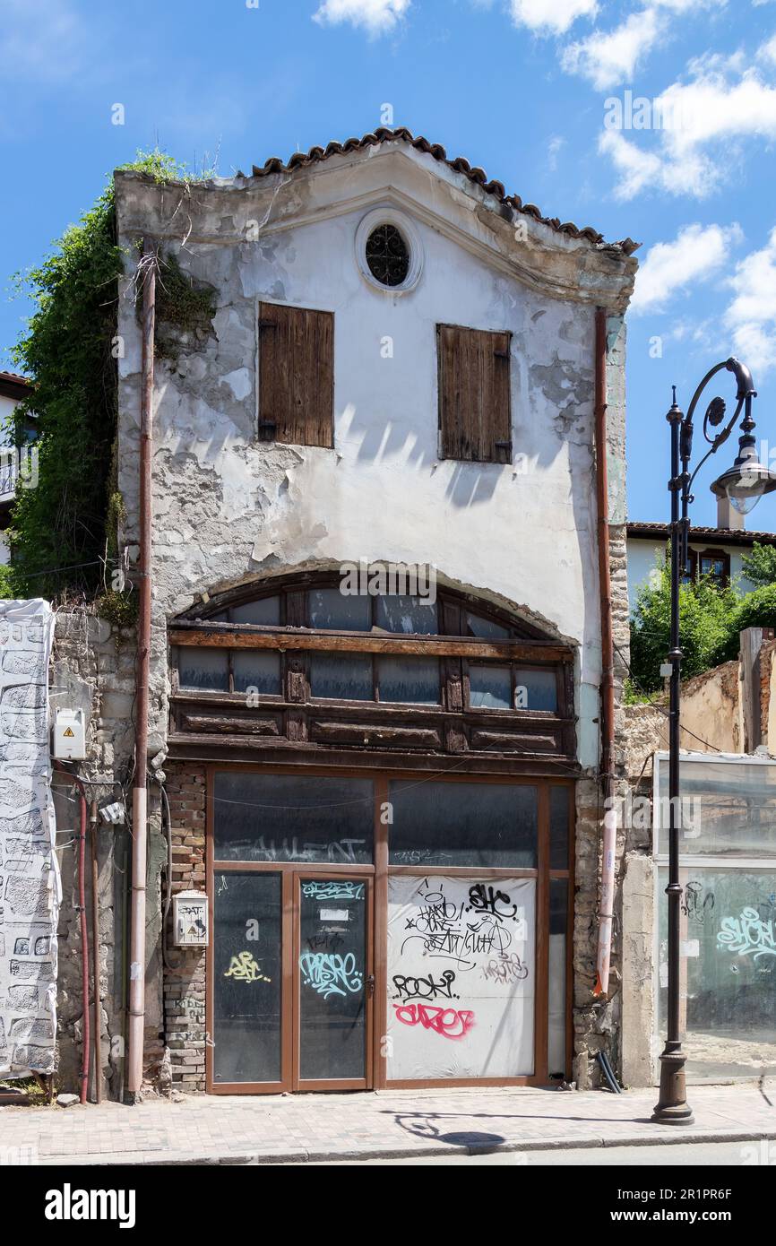 Run down and damaged buildings still showing signs of the decline in fortunes and not yet restored like other parts of the town, Veliko Tarnovo. Stock Photo