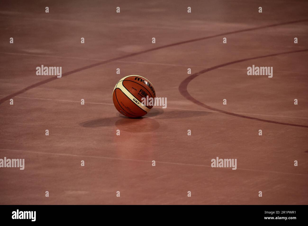 A basketball ball on a basketball court floor Stock Photo Alamy