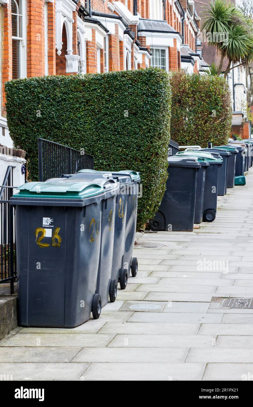 Plastic wheelie bins line a residential street in Haringey, North