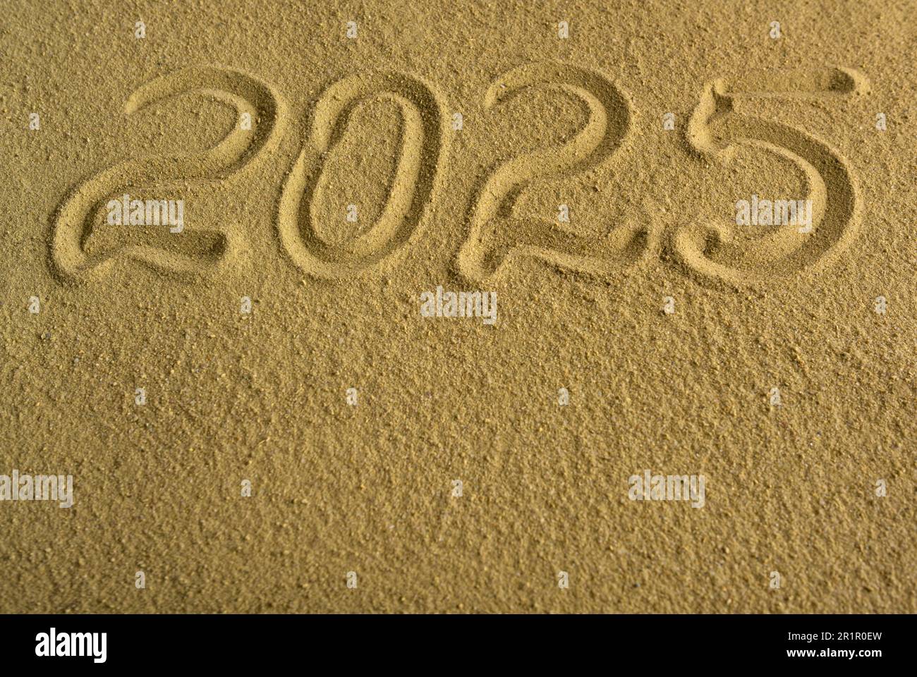 The inscription 2025 on the sea sand Stock Photo Alamy