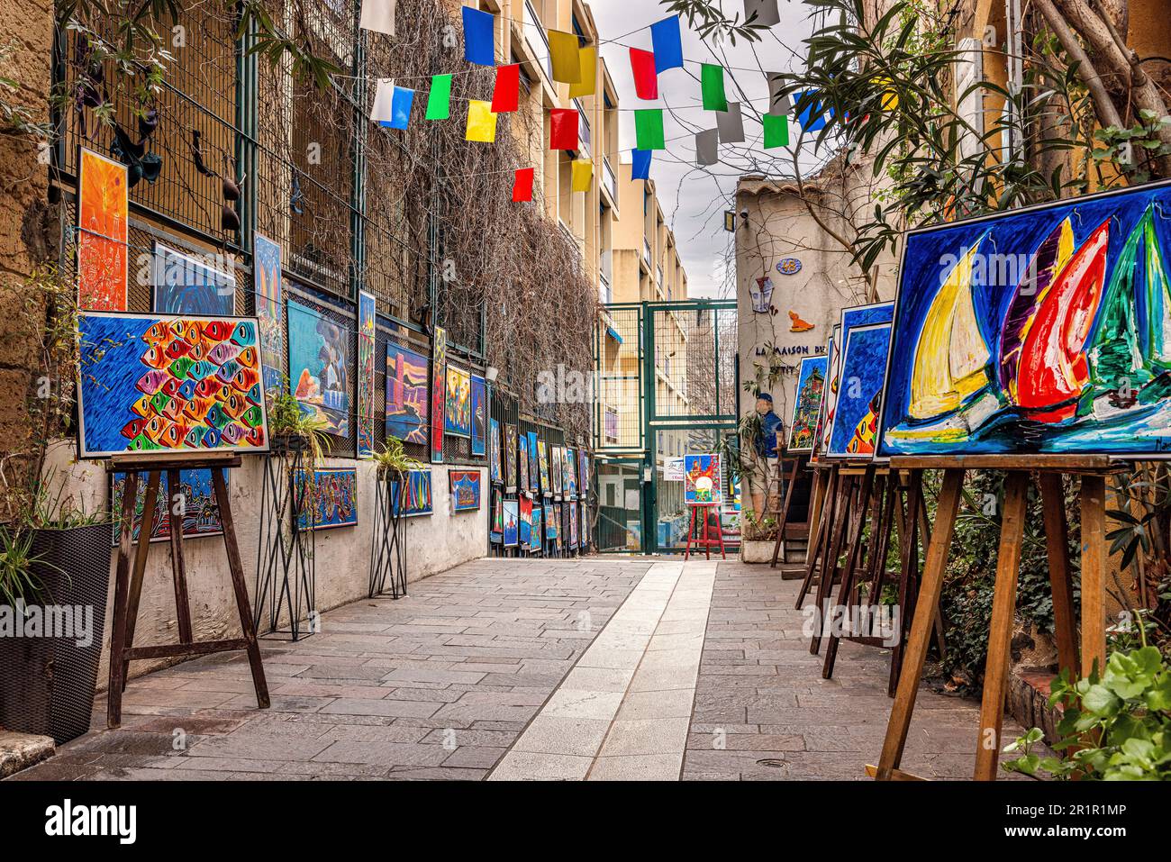 Alley with paintings on display in Le Panier neighborhood, Marseille, Provence-Alpes-Cote d'Azur, France, Stock Photo