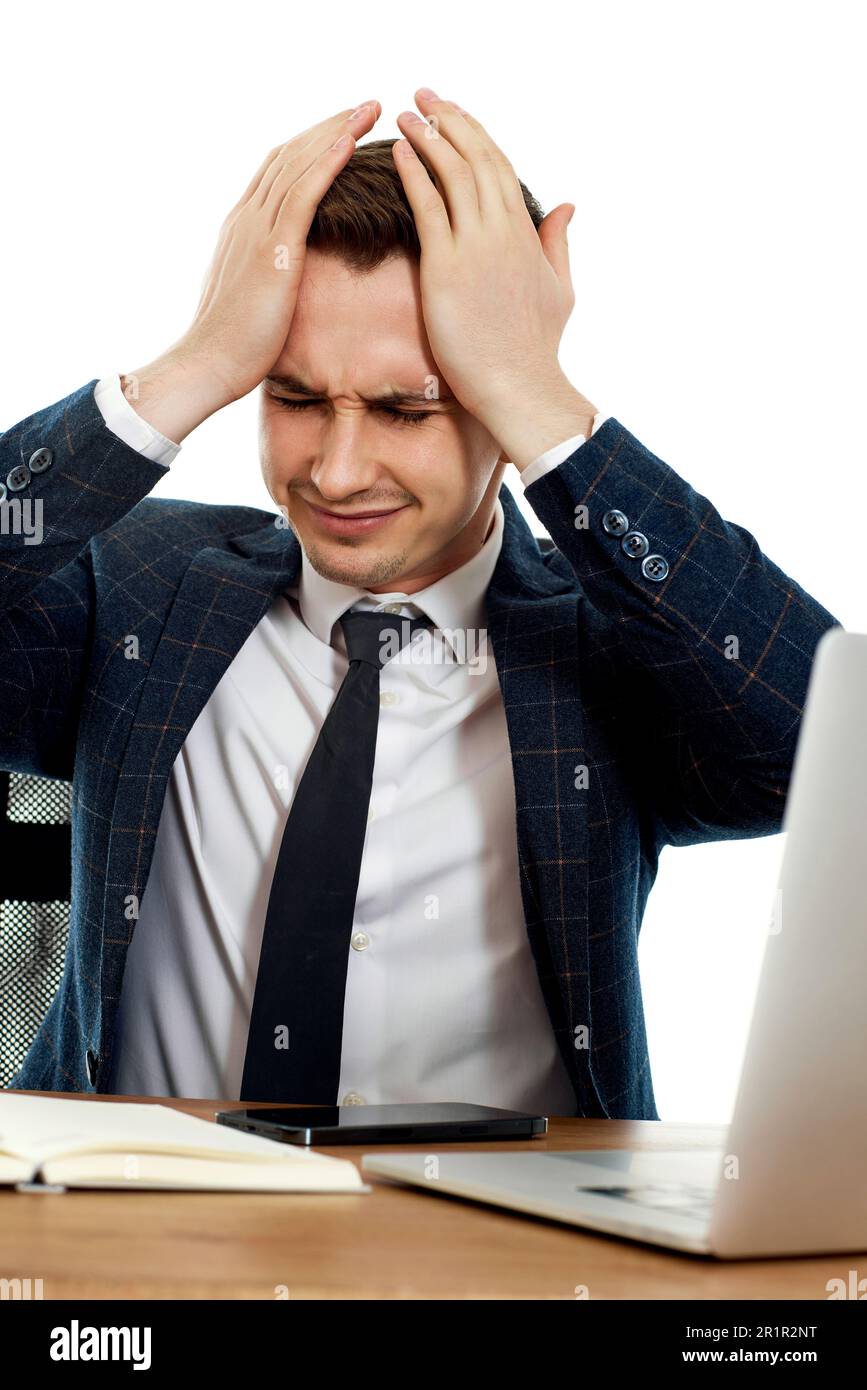 businessman using laptop having problems thinking about troubles Stock Photo