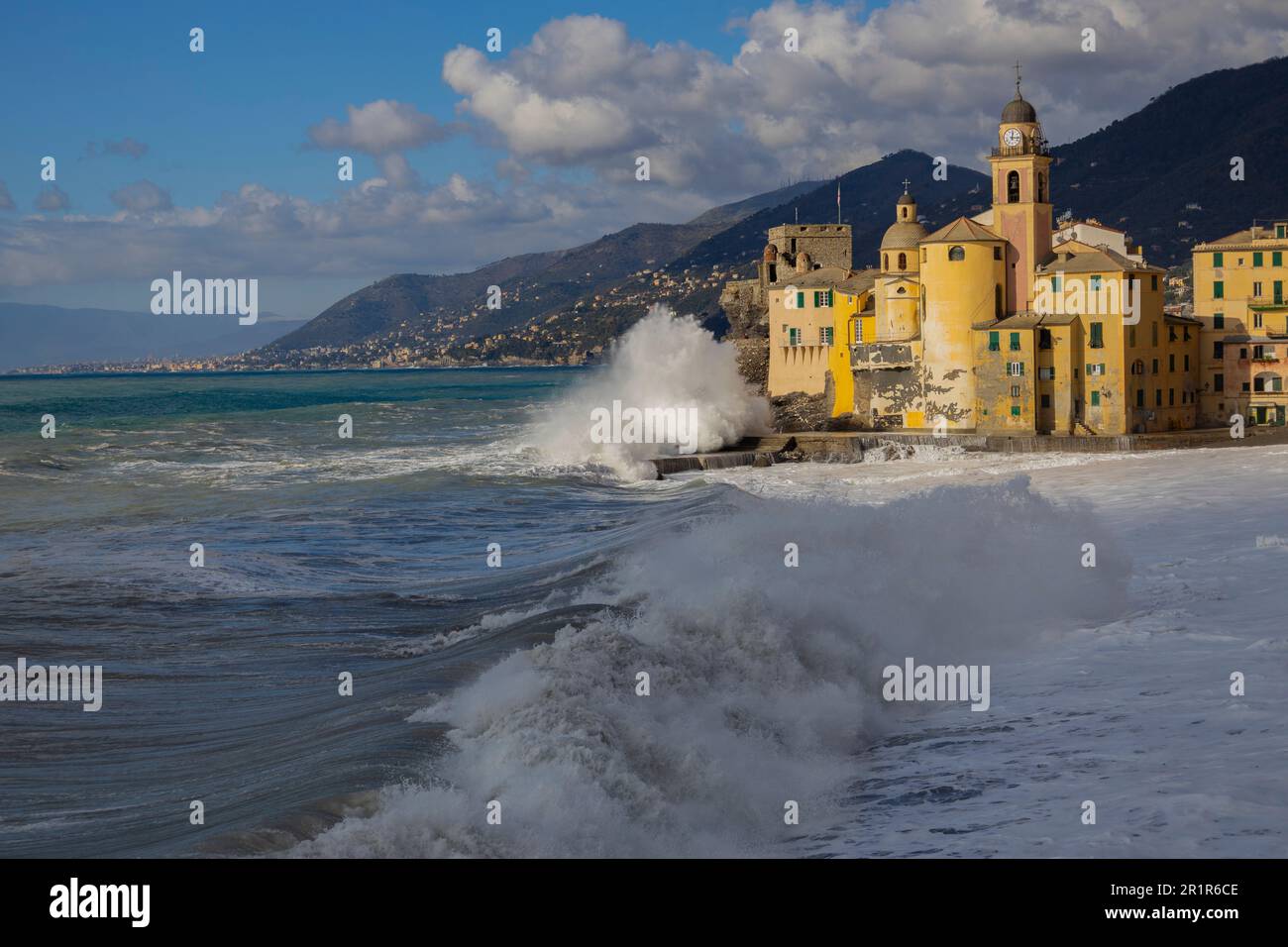 Rough sea on the beach of Camogli and the Basilica of Santa Maria Assunta,  Genoa province, Italy. Stock Photo