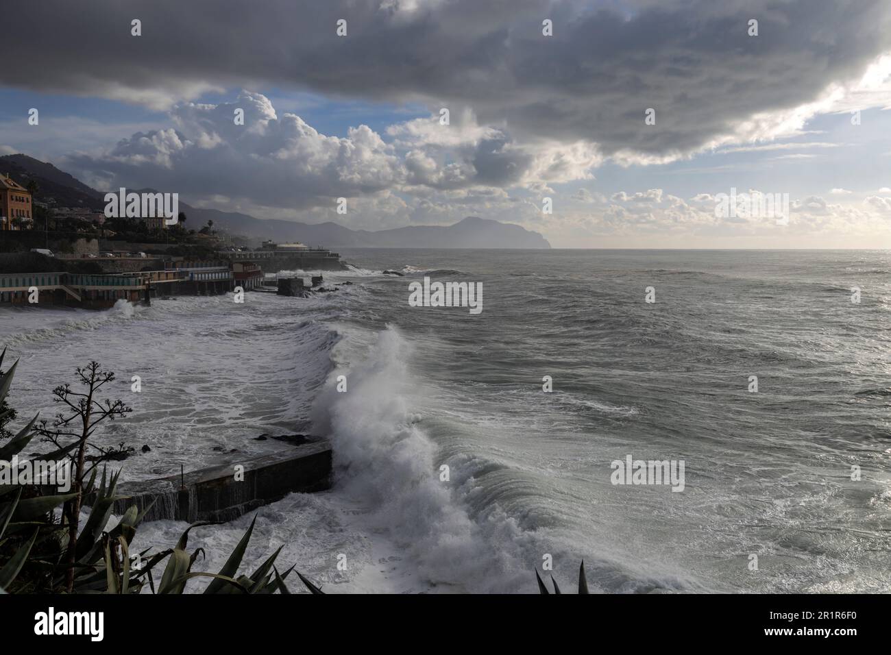 Rough sea and sky with clouds on the beach of Genoa Quinto, Italy Stock
