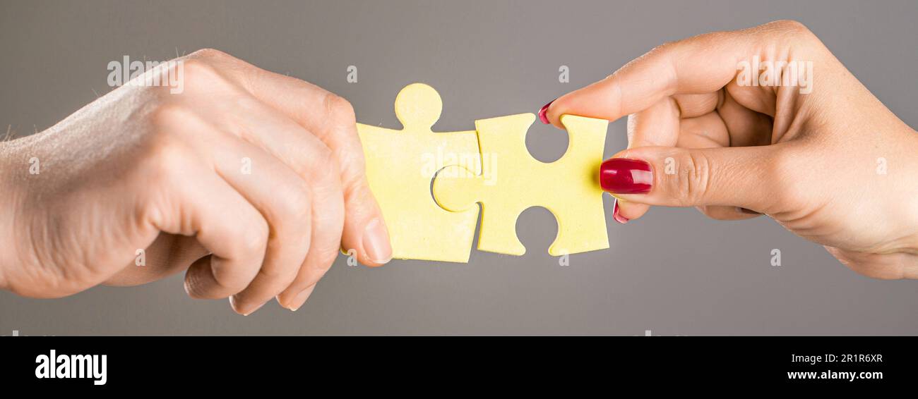 Hands hold puzzles. Hands connecting puzzle. Puzzles. Hand of the child