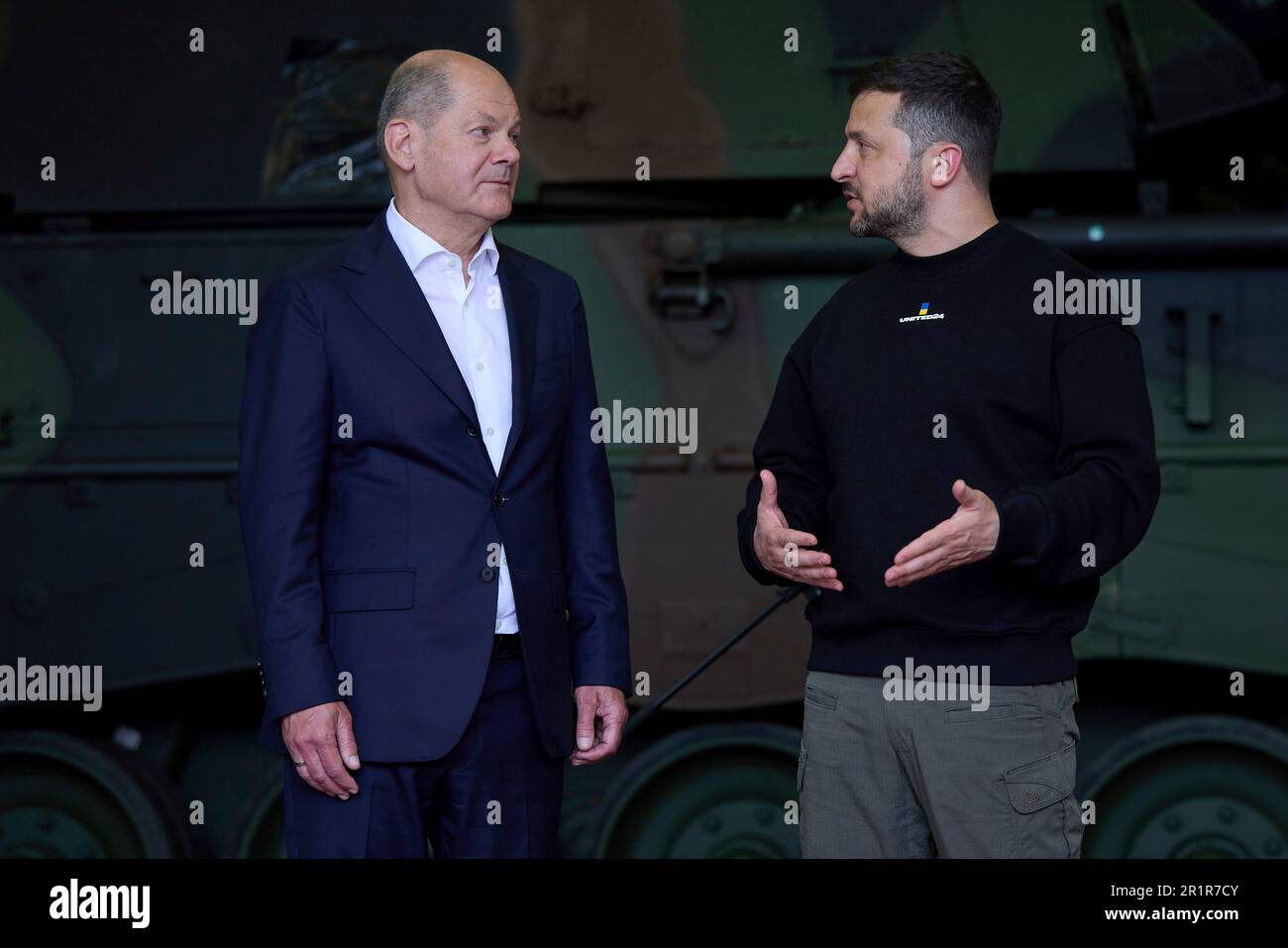 Aachen, Germany. 14th May, 2023. German Chancellor Olaf Schotz, left, listens to Ukrainian President Volodymyr Zelenskyy, right, during visit to Camp Aachen, May 14, 2023 in Aachen, Germany. The Germany Army is training Ukrainian soldiers on military hardware provided by Germany at the base. Credit: Pool Photo/Ukrainian Presidential Press Office/Alamy Live News Stock Photo