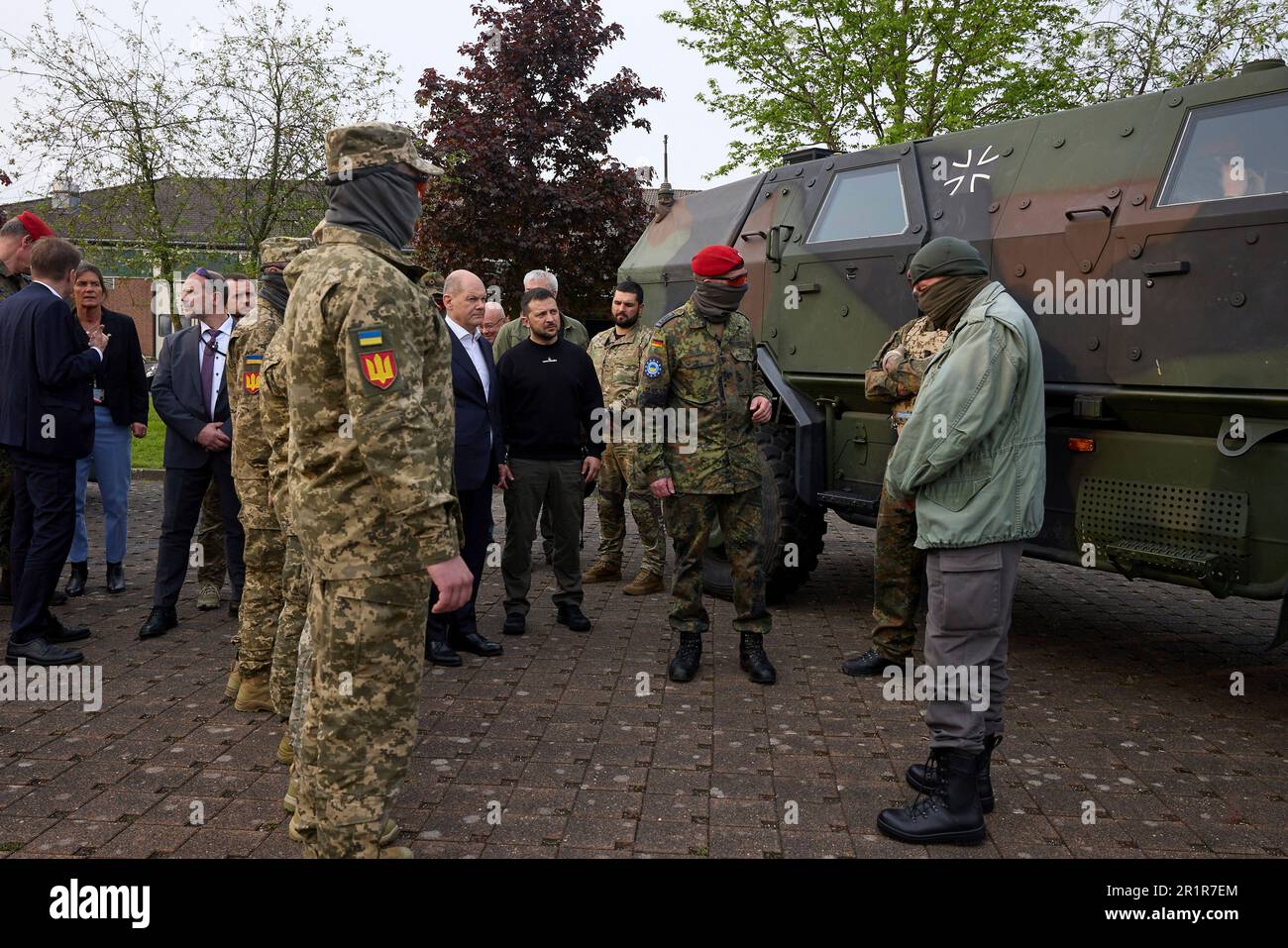 Aachen, Germany. 14th May, 2023. German Chancellor Olaf Schotz, left, and Ukrainian President Volodymyr Zelenskyy, center, watch a demonstration during a visit to Camp Aachen, May 14, 2023 in Aachen, Germany. The Germany Army is training Ukrainian soldiers on military hardware provided by Germany at the base. Credit: Pool Photo/Ukrainian Presidential Press Office/Alamy Live News Stock Photo