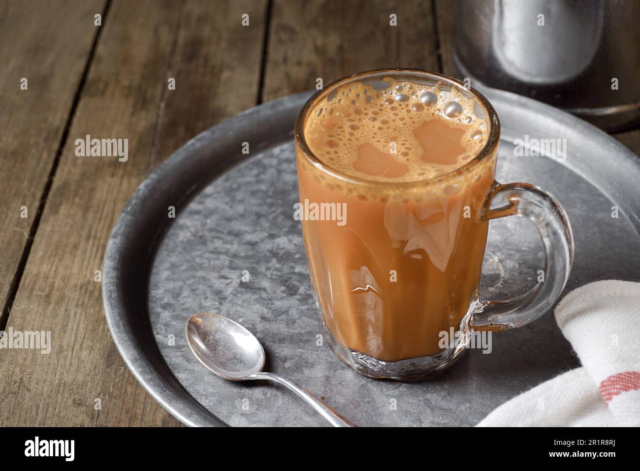 Hot drink tea with milk Malay called Teh Tarik is a popular breakfast